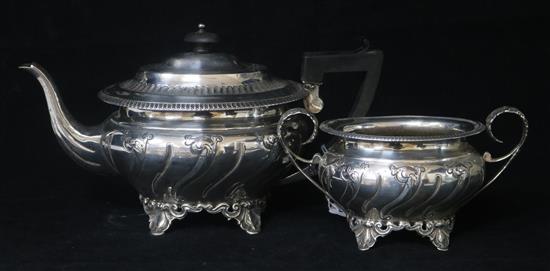 A George V embossed silver teapot and sugar bowl, by Henry Matthews, Birmingham, 1916, gross 28.5 oz.